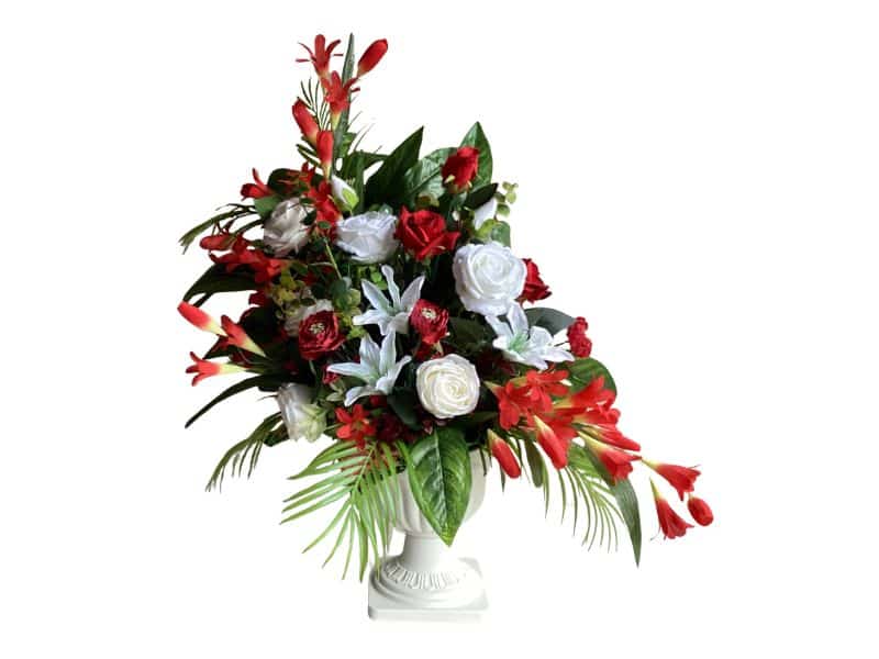 Flowers memorial red and white in white urn